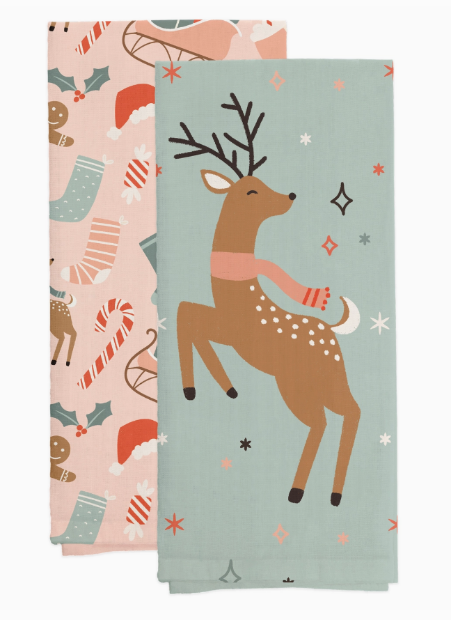 Two decorative tea towels with Christmas-themed designs featuring reindeer and winter elements.
