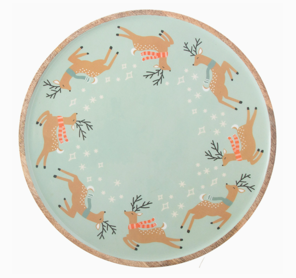 Round wood plate with reindeer design on a light blue background